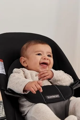 The fabric harness keeps a young infant centered while the seat self-bounces from movement.