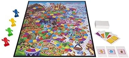 The unfolded board, gingerbread pawns, and color-coded cards laid out — every game state the rules r