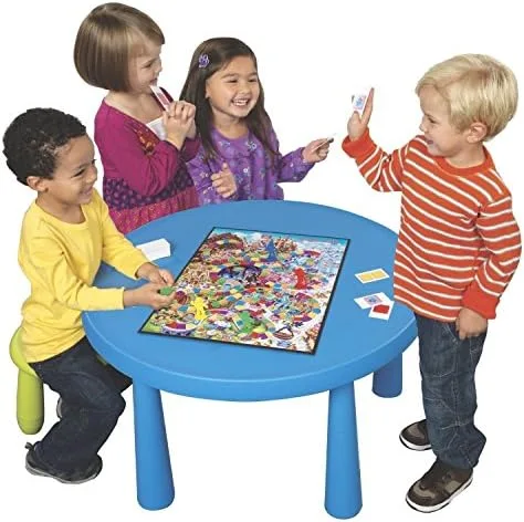 Four preschoolers around the board demonstrate the game's actual zone: turn-taking practice before r