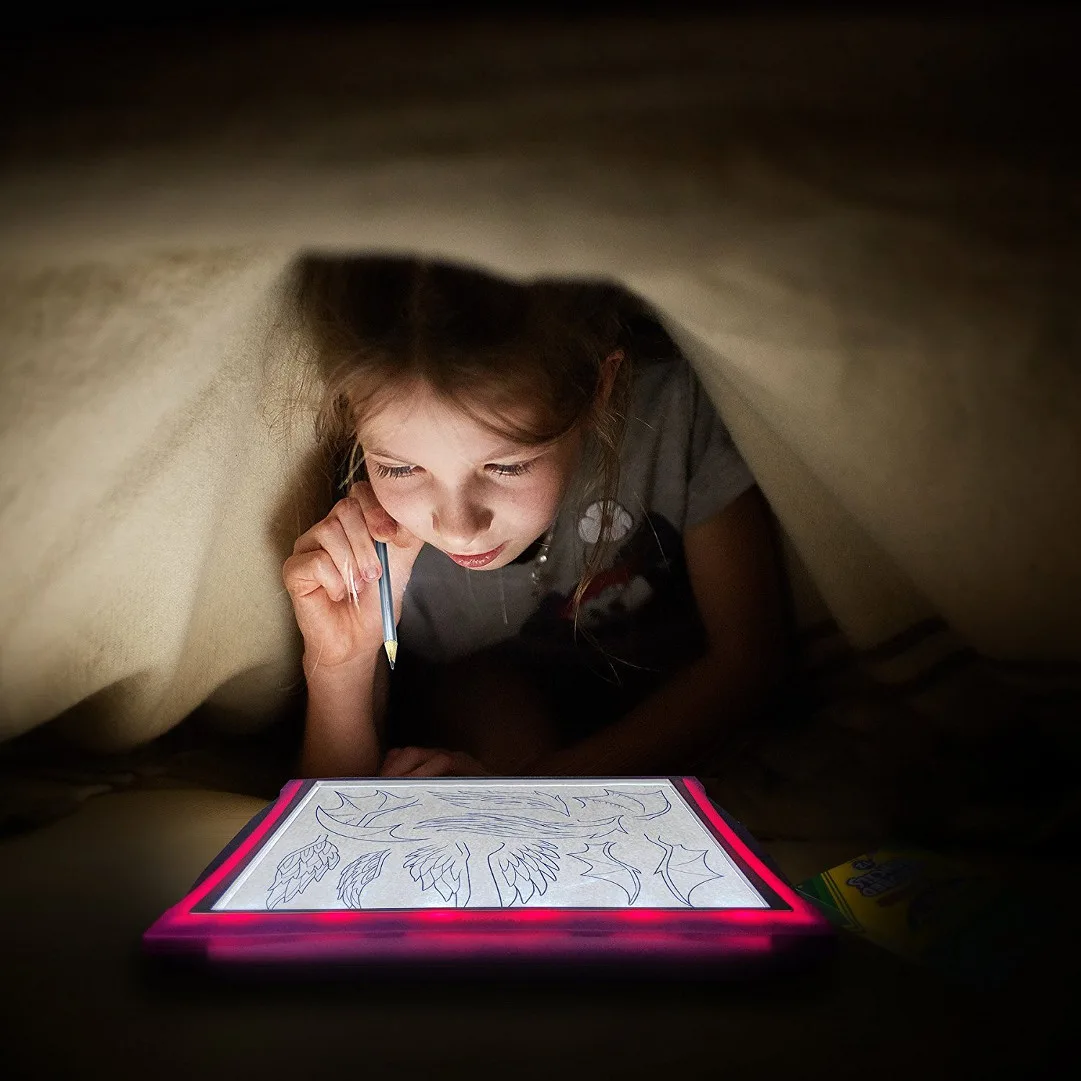 Under a blanket, the LED panel does what marketing promises — it actually lights the line.
