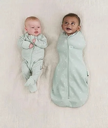 Two newborns side by side: a standard footed sleeper alongside the zip-front Cocoon, showing the snu