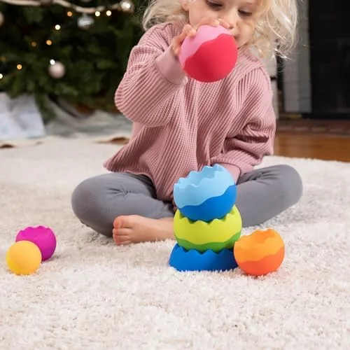 Each piece weighs differently, so the youngest builders learn to test before they commit.