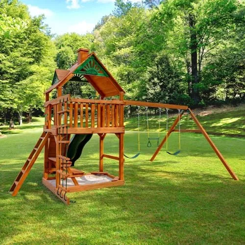 Side angle reveals the rock wall, sandbox bay, and trapeze swing arrangement at full scale.