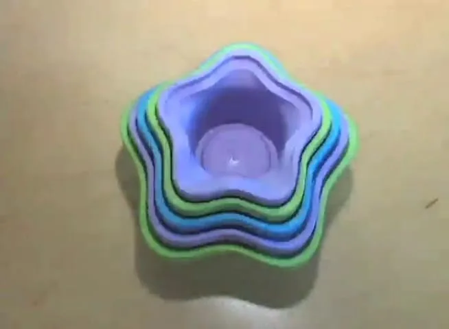 Viewed from above, the nested cups reveal the gentle pastel gradient that makes ordering them legibl