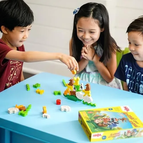 Three siblings testing the dexterity stakes that make Animal Upon Animal a genuine party game.