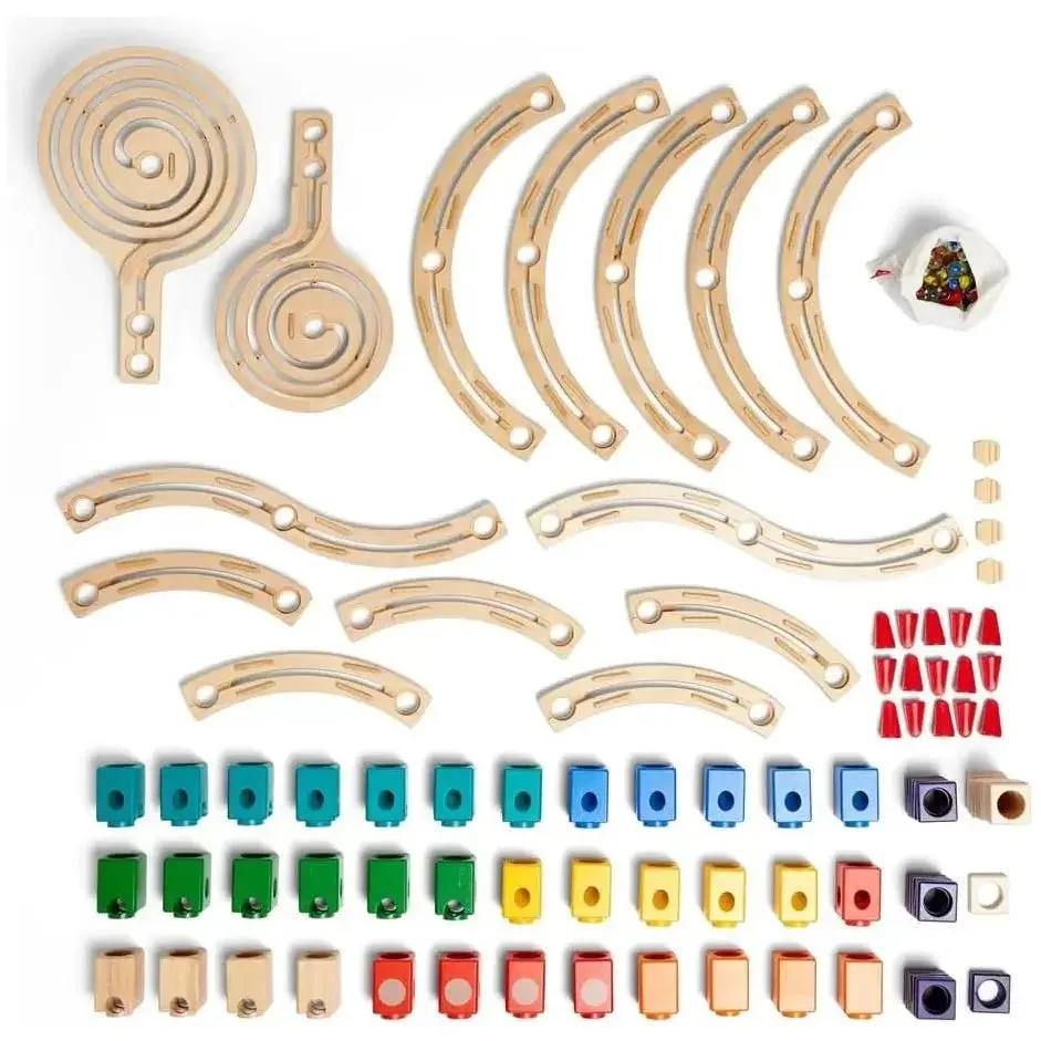 Every piece in the box: spiral platforms, curved tracks, action blocks, and the colored cubes that r