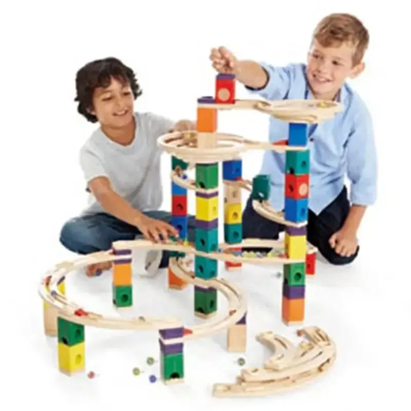 Two children testing a build together, the cooperative engineering moment the Quadrilla quietly invi