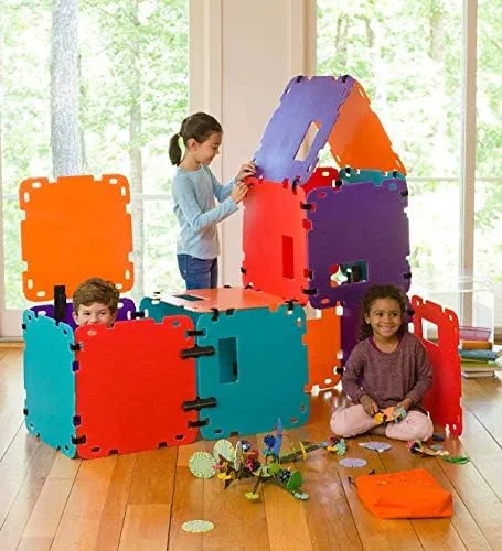 A larger configuration in a living room: three children, multiple rooms, panels still being added.