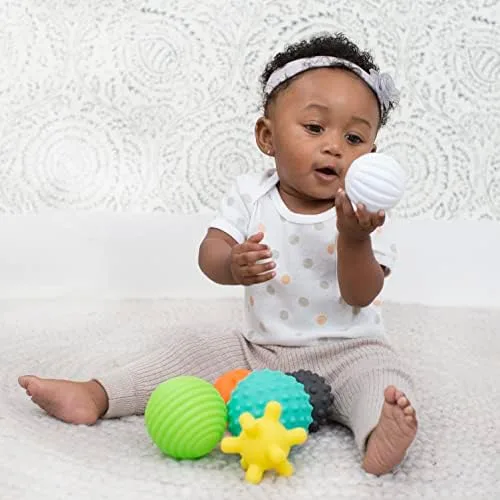 Single-handed grip on the ribbed white ball demonstrates the set's age-appropriate sizing.