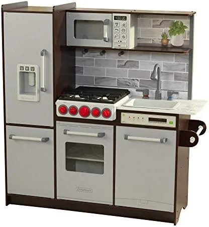 The Uptown Elite kitchen photographed straight-on, showing fridge, range, microwave, and sink in esp
