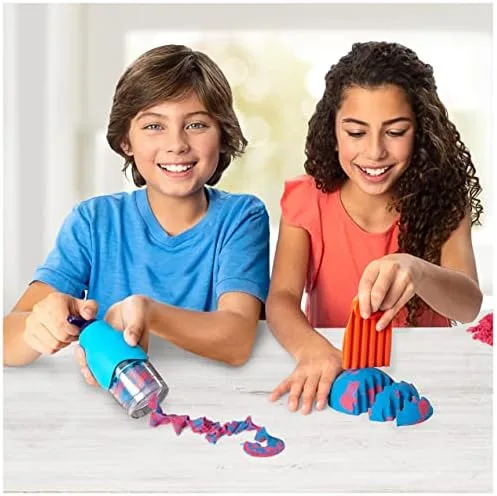 Two children extrude and slice the sand, a study in how the medium turns hands into instruments.