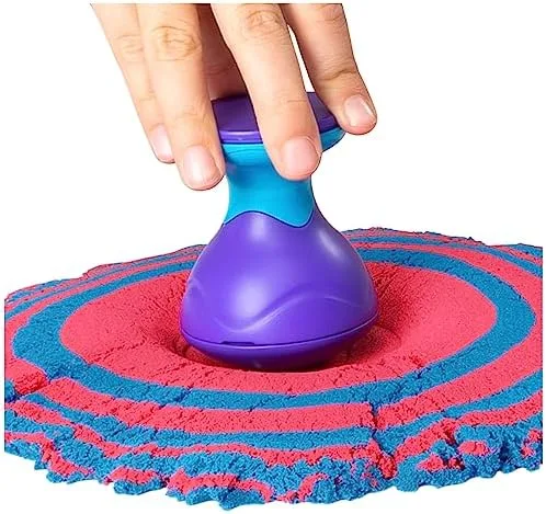 A press tool sinks into a packed mound, leaving the concentric ridges that make the medium photogeni