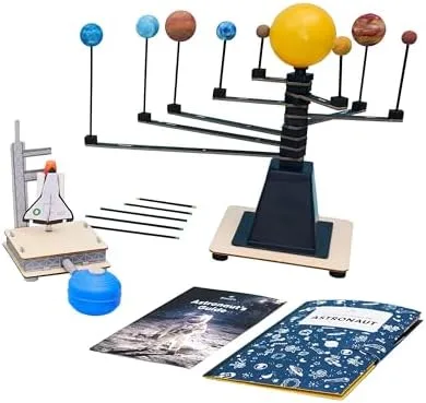 A representative monthly project: solar system model, paints, instruction booklet, and supplementary