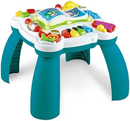 The Learn and Groove table viewed at toddler standing height, all four play zones visible.
