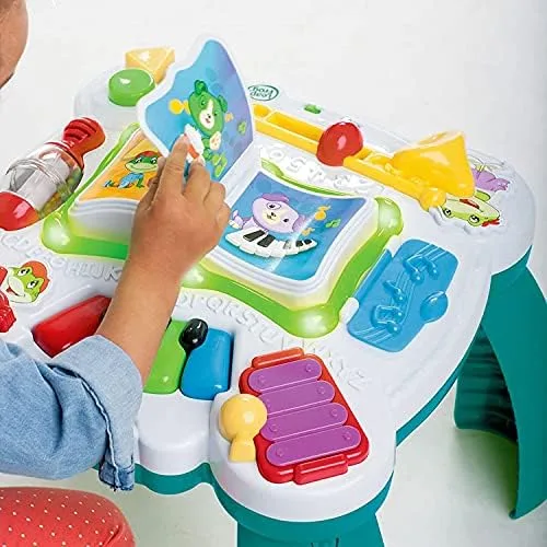 A toddler interacts with the interactive book panel, the table's most replayed feature.