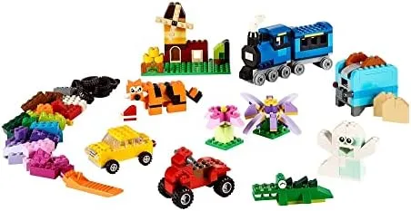 A cross-section of the brick assortment: vehicles, animals, flowers, and the loose pieces that make 
