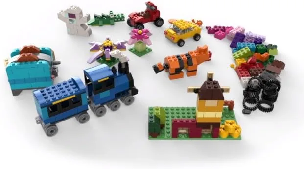 Sample builds arranged together: a train, a windmill, a tiger, and the small architectures children 