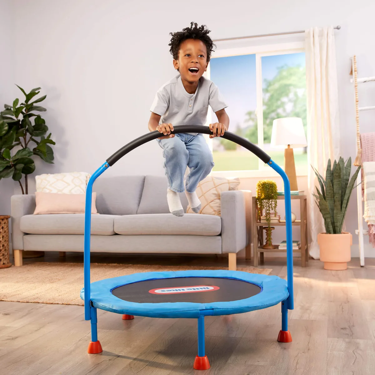 Mid-jump: the handlebar gives toddlers the confidence to add real height to their bouncing.