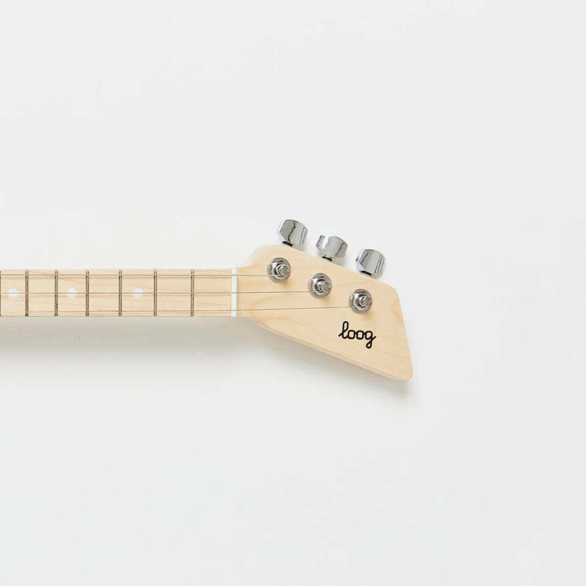 Two children play Loog Minis together; the three-string scale lets small hands actually fret real ch