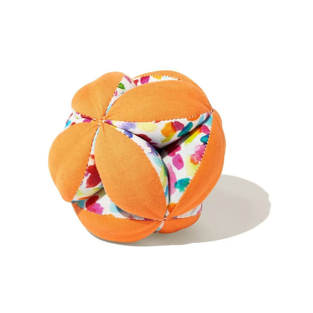 The Buddy Ball's grippable petal construction — orange panels and floral lining give infants varied 