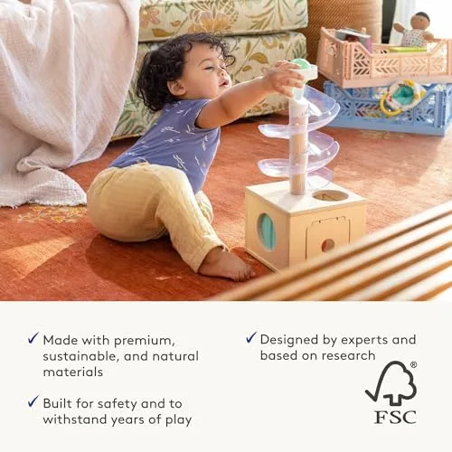 Lovevery's lifestyle imagery showing children using the kit's signature objects — the wood-toy aesth