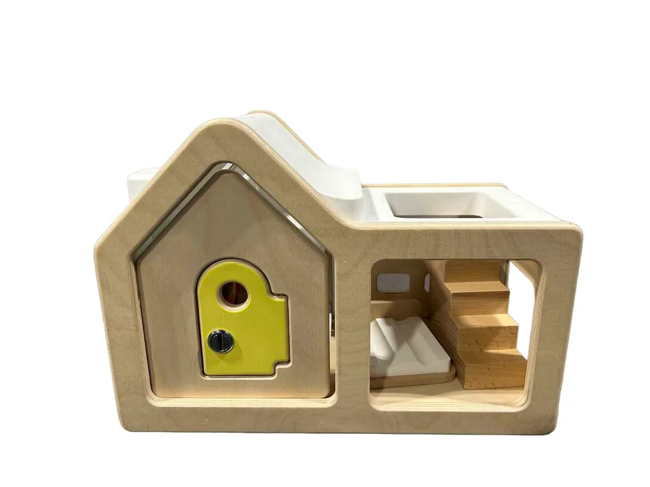 Assembled Playhouse showing locking door, interior staircase, and pitched-roof silhouette in one con