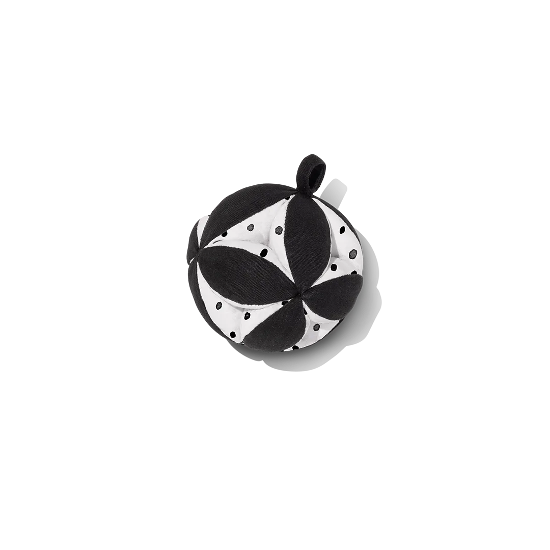 The high-contrast tactile ball, designed to register clearly against an infant's still-developing vi