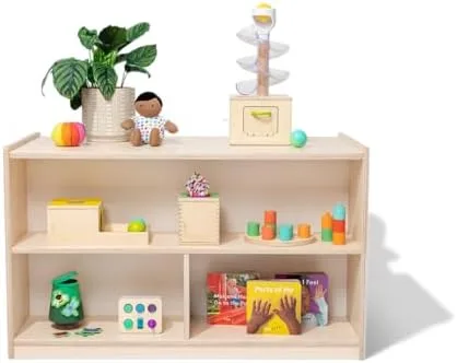 The Playshelf as Lovevery stages it: low, blond birch, six exhibits at child-height, calm by design.