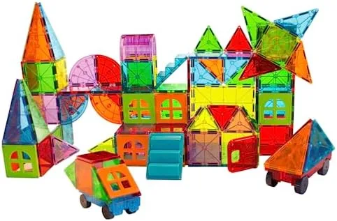 The 110-piece set assembled into a small village: windows, doors, arches, and two rolling vehicles.