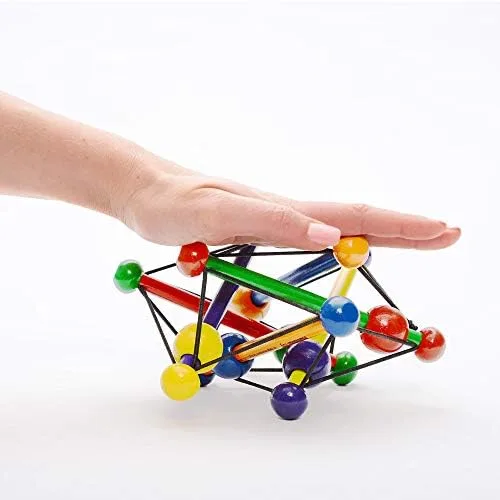 An adult hand demonstrates how the elastic frame compresses and rebounds.