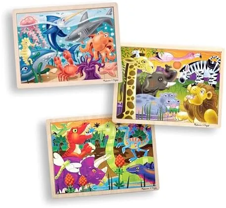All three twenty-four-piece puzzles in the pack: Under the Sea, African Plains, and Dinosaur themes.