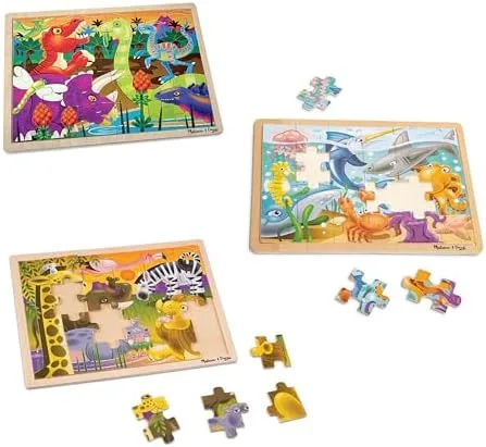 Loose pieces beside their wooden trays, showing the chunky cuts that toddler fingers can actually ma