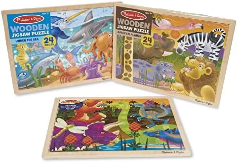 The packaged trio as it ships, three wooden trays with their puzzles intact inside.