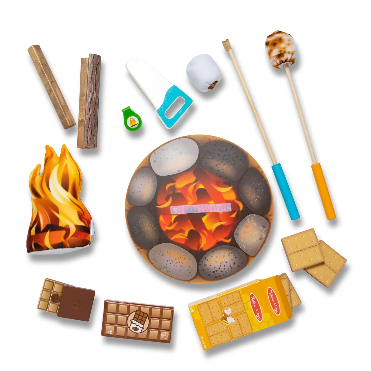 A top-down view of the fabric flame, stone fire ring, and pretend-food components.