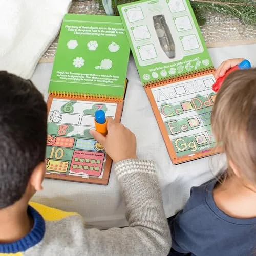 Two children working through Number and Alphabet pads side by side, water pens in hand.