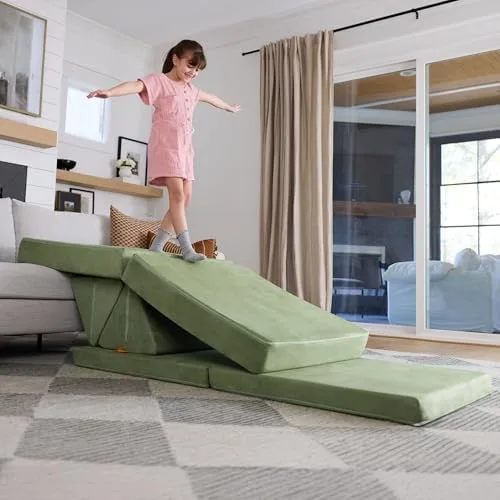 A child balances along a wedge configuration — the Nugget reconfigured as a low-stakes balance beam.