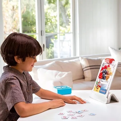 A child arranges letter tiles below the iPad while the reflector reads the play space above.