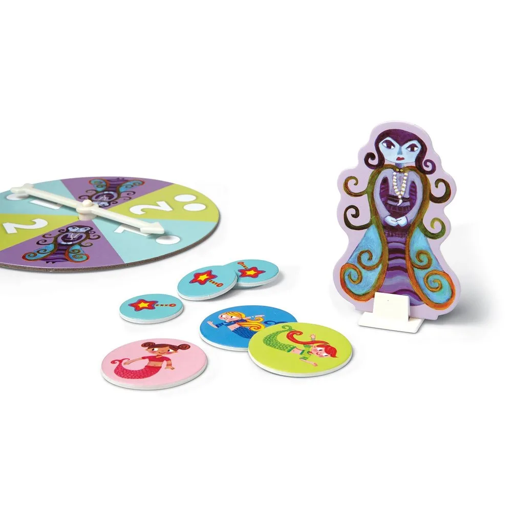 Components arranged for setup — spinner, tokens, and the Sea Witch standee that drives the cooperati