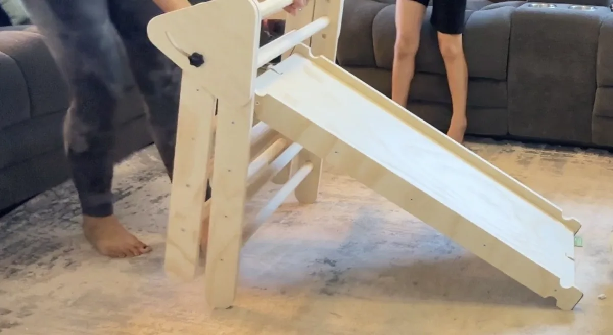 Smooth ramp side hooks onto the triangle frame, converting the climber into a slide in seconds.