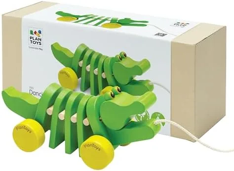 The Dancing Alligator and its retail packaging, showing the articulated rubberwood segments.