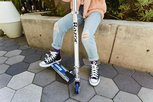 The folding aluminum frame and rear fender brake — the two design choices that define this scooter.
