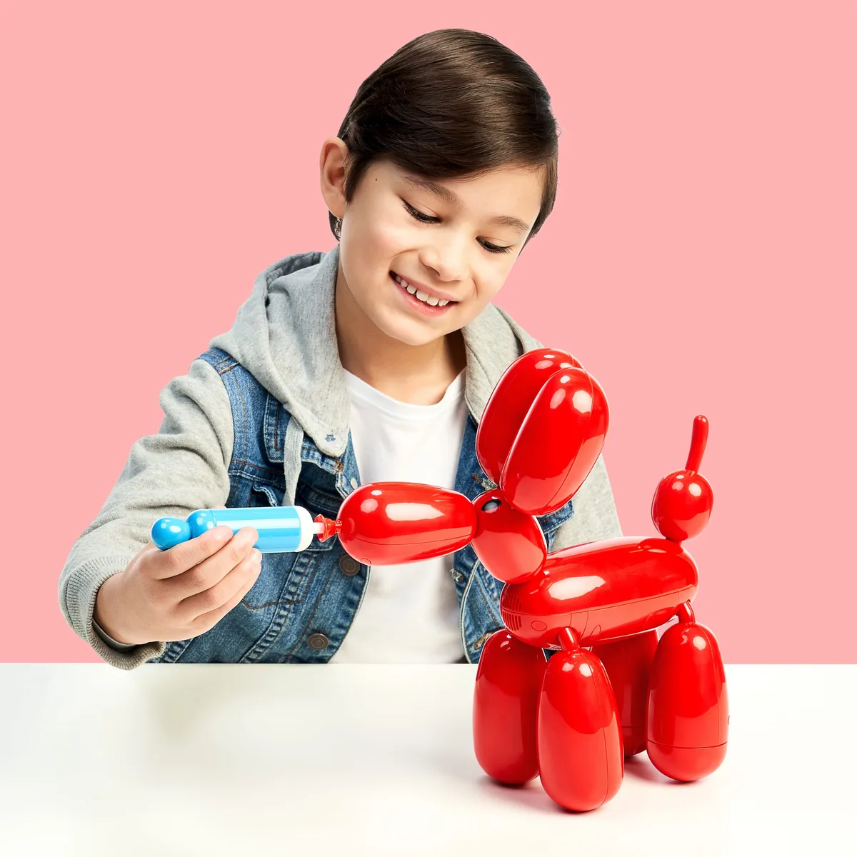 Pumping Squeakee triggers an inflate animation, one of more than sixty programmed responses.