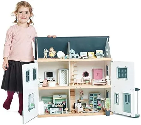 Open and fully furnished, the dollhouse demonstrates its scale relative to a preschool-aged child.