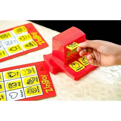 A close view of the dispenser pushing fresh tiles forward, words paired with pictures.