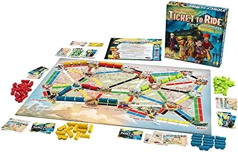 A full setup: board, train cards, plastic trains, and route tickets fanned across the table.