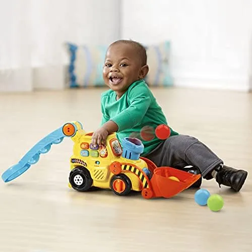 Floor-level play reveals how the chimney and scoop draw younger toddlers into cause-and-effect explo